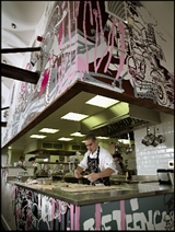 Photo of a a chef in the kitchen at Fifteen Cornwall